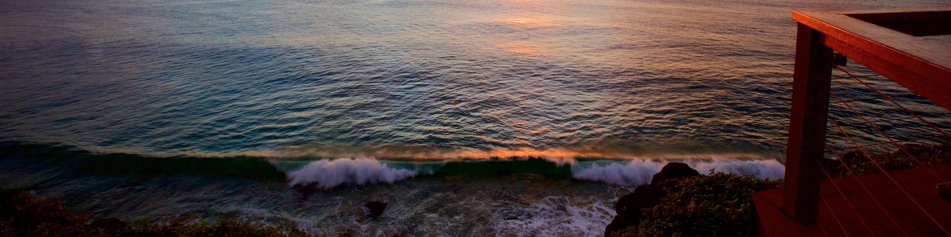 Point Danger showing general coastal views, landscape views and a sunset