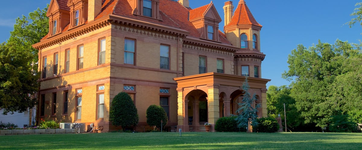 Overholser Mansion featuring heritage elements, a garden and a house