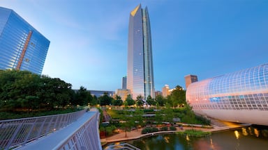 Oklahoma City which includes a skyscraper, a river or creek and a sunset