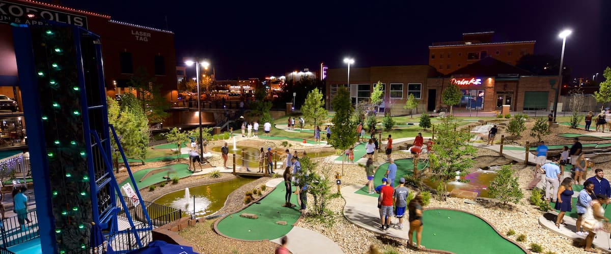 Bricktown which includes golf and night scenes as well as a small group of people