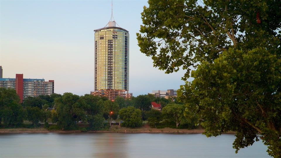 Tulsa featuring a sunset, a lake or waterhole and a high-rise building