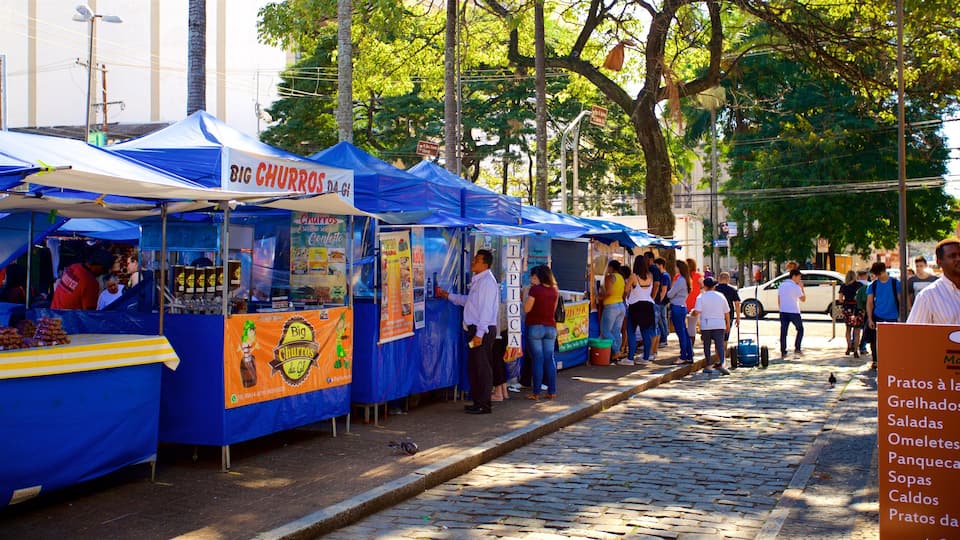 Campinas que inclui mercados e cenas de rua assim como um pequeno grupo de pessoas