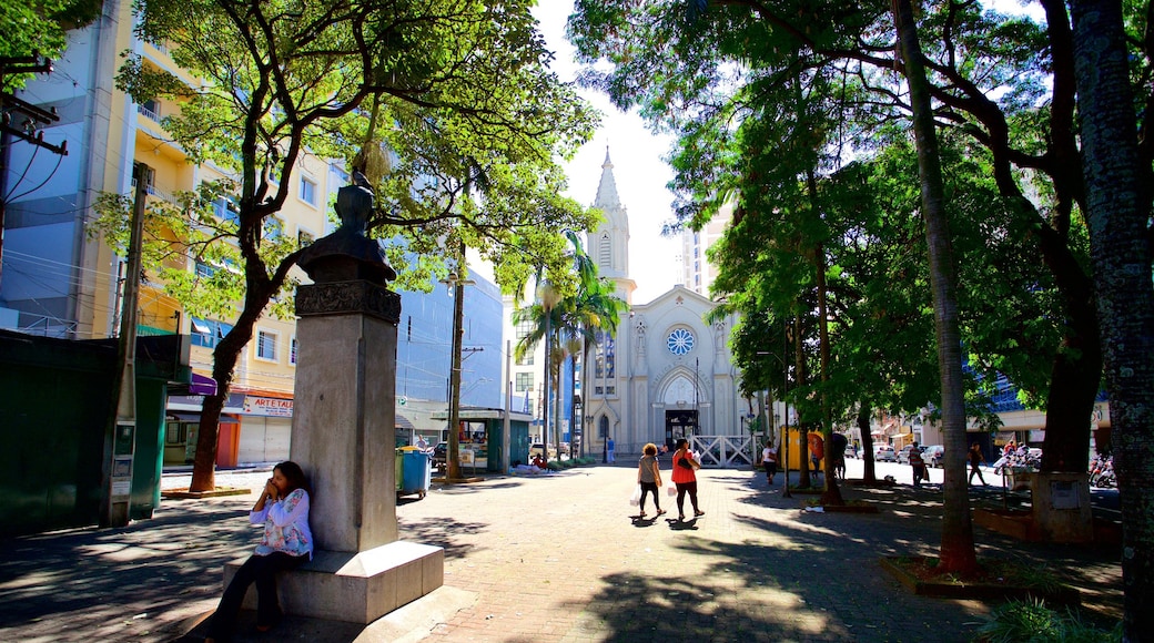 Basilica of Our Lady of Mount Carmel featuring heritage elements as well as an individual female