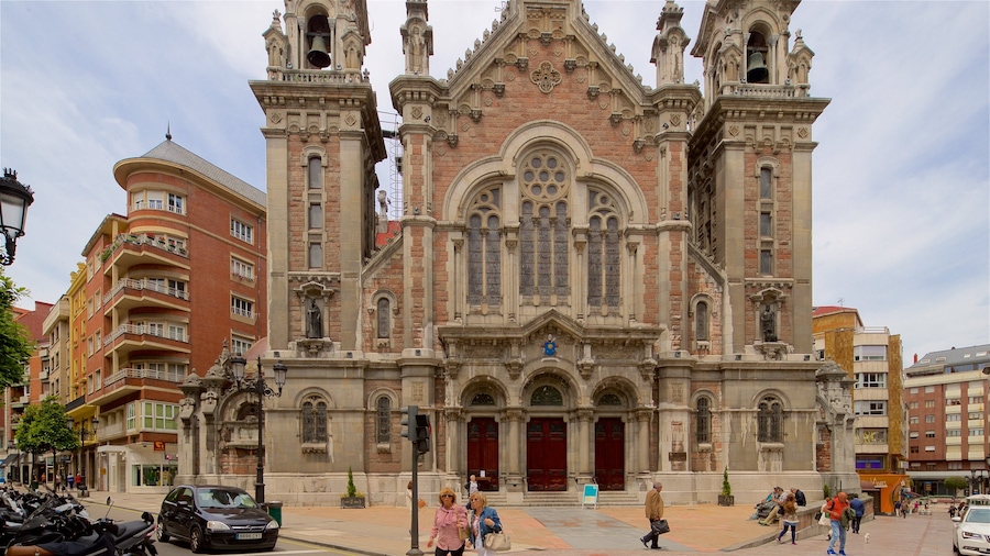 Church of San Juan which includes a city, a church or cathedral and heritage architecture