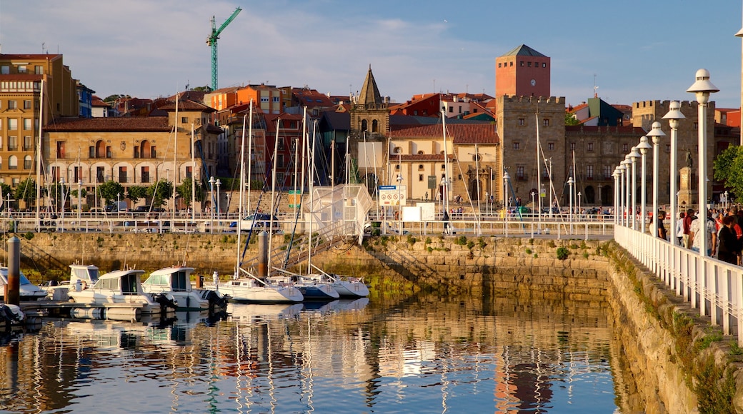 Gijon showing a bay or harbor, a sunset and a city