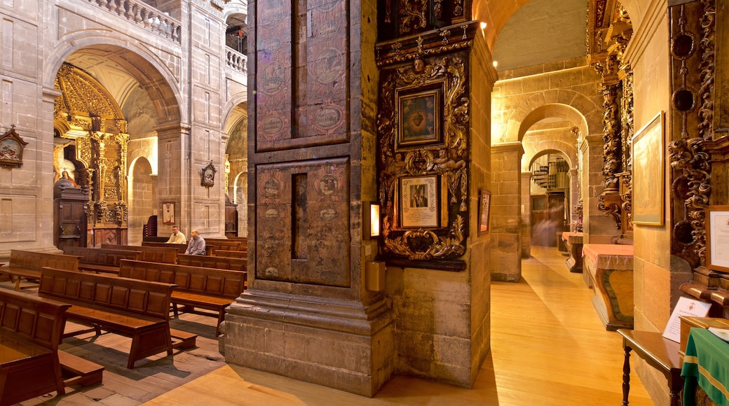 Church of San Isidoro featuring a church or cathedral, interior views and heritage elements