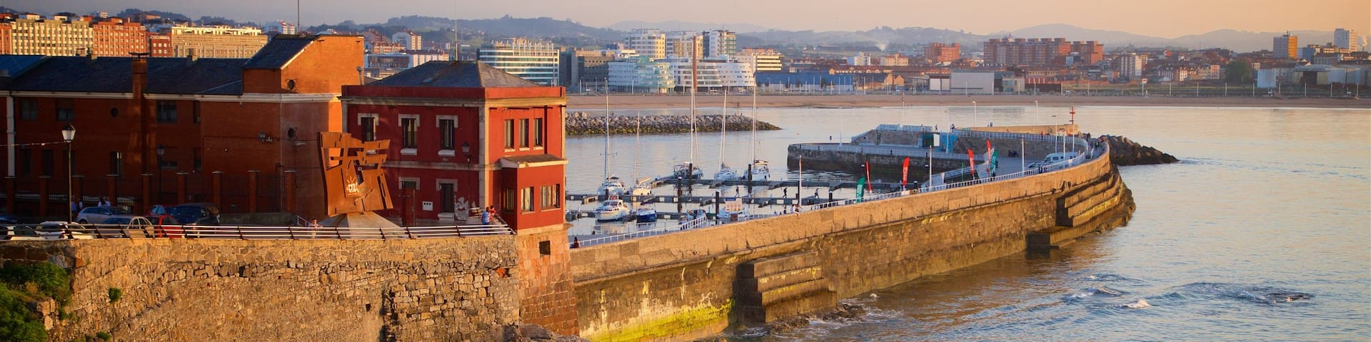 Cerro Santa Catalina Park showing a coastal town, a sunset and rugged coastline