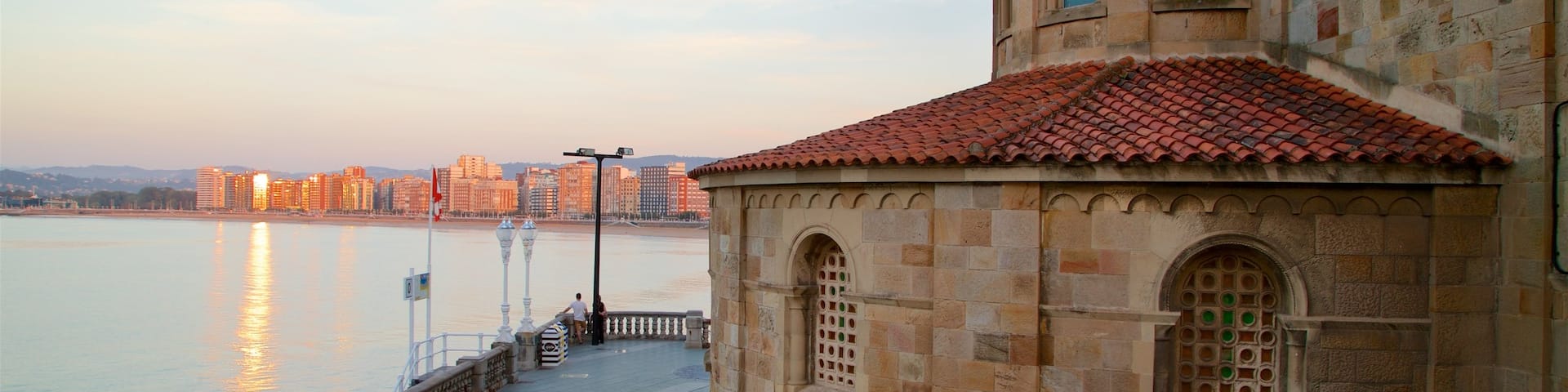 Gijon featuring heritage elements, a sunset and a city