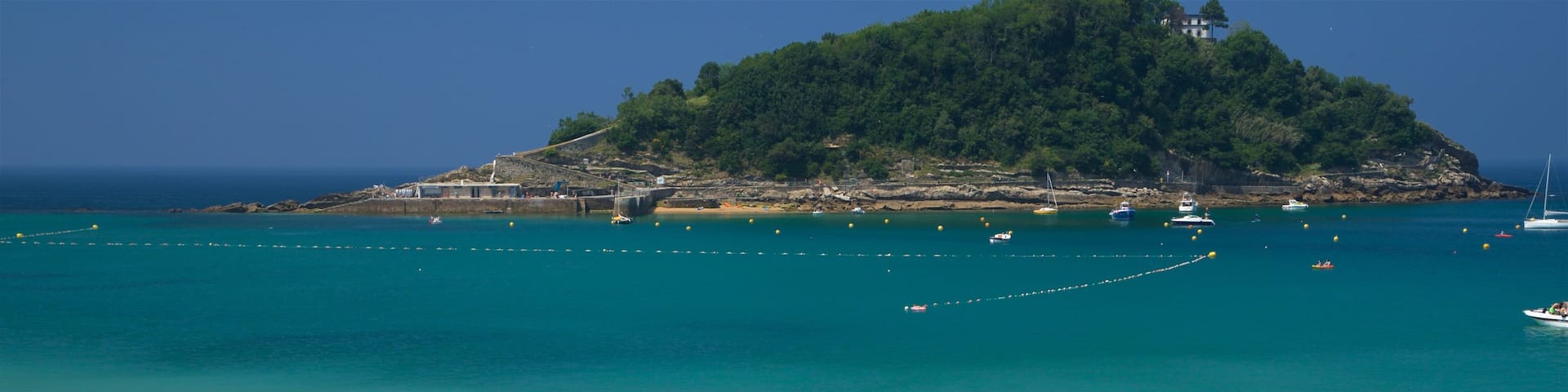Santa Clara Island showing island views, a bay or harbour and general coastal views