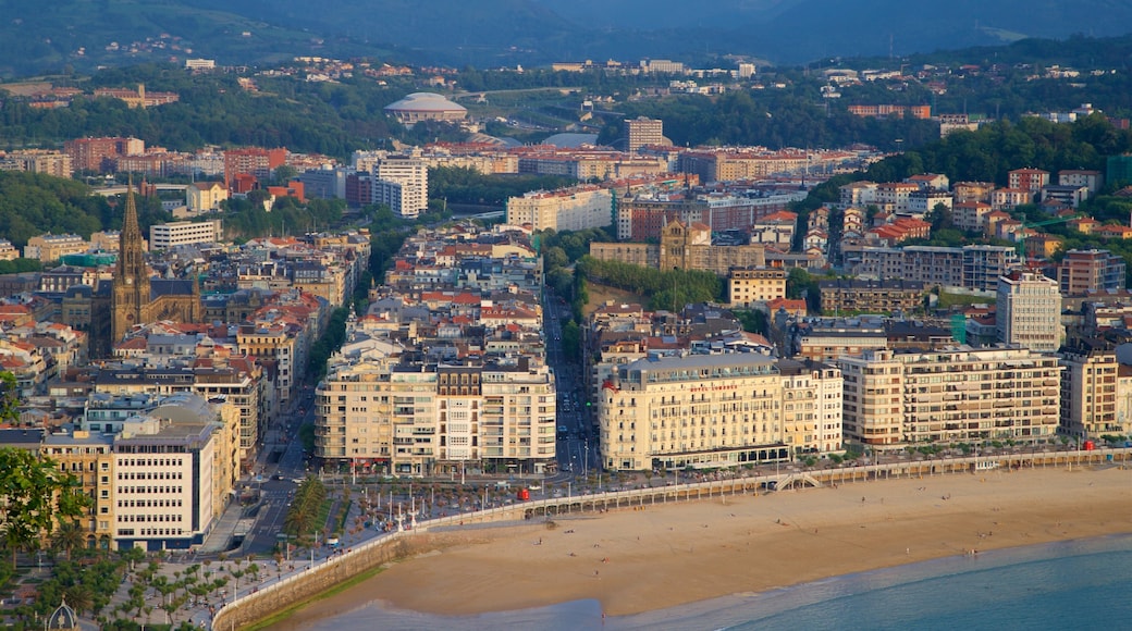 Monte Urgull which includes a beach, a coastal town and general coastal views