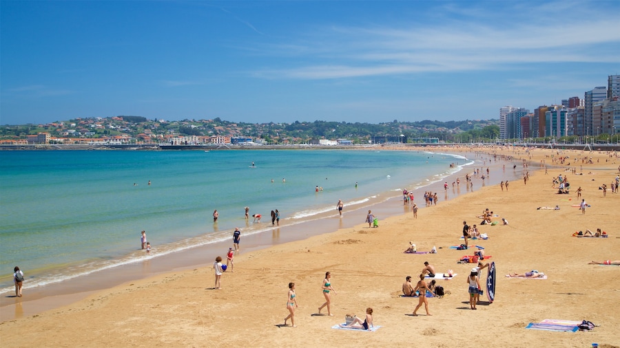 Playa de San Lorenzo mostrando una playa, una ciudad y vistas de una costa