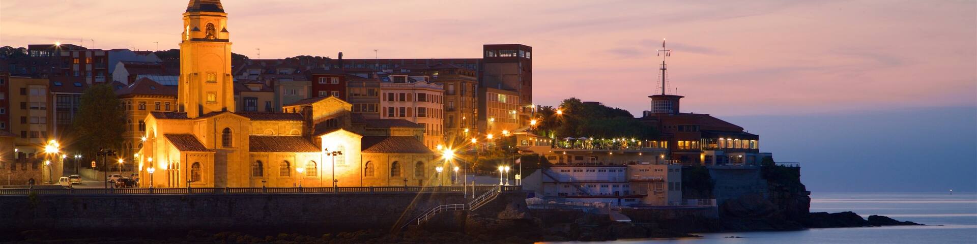 San Lorenzo Beach featuring heritage architecture, a sunset and general coastal views