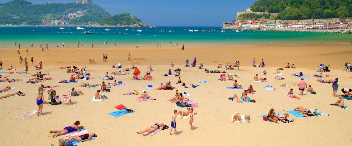 Concha Beach showing general coastal views, swimming and a coastal town
