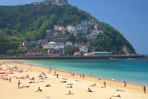 Ondarreta Beach which includes a sandy beach, general coastal views and a coastal town