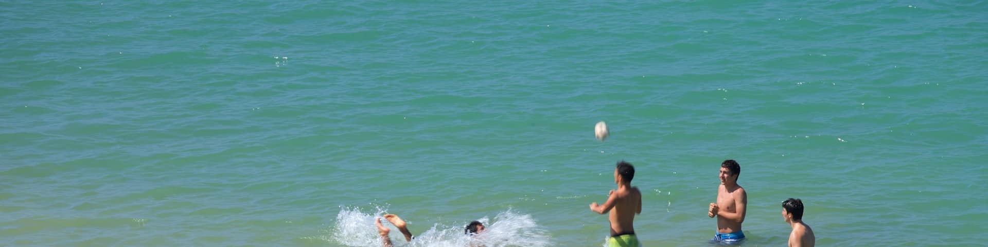 Ondarreta Beach featuring swimming, a beach and general coastal views
