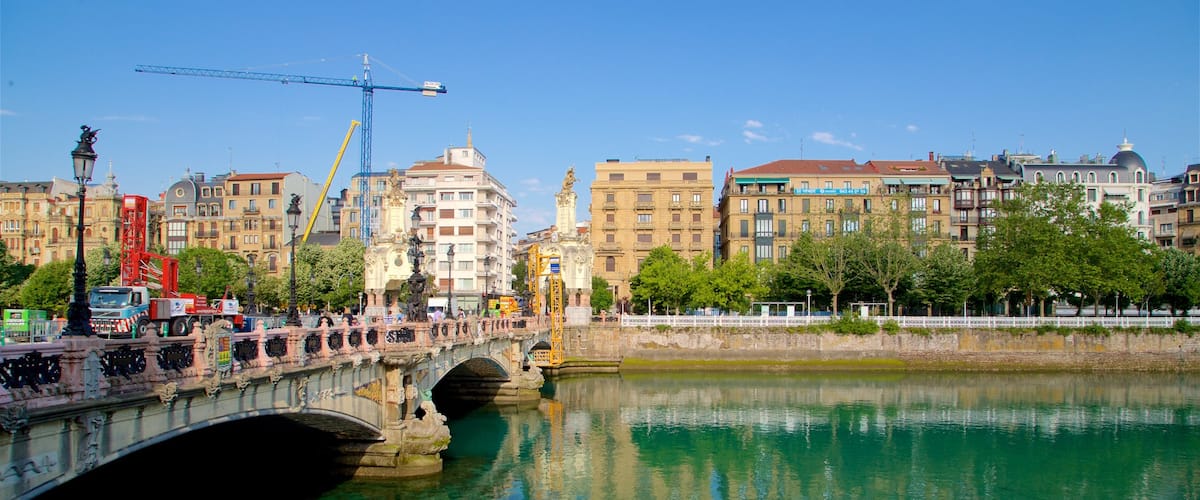 Maria Cristina Bridge featuring a river or creek, a bridge and a city