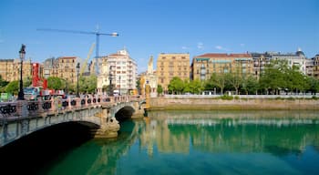 Maria Cristina Bridge featuring a river or creek, a bridge and a city