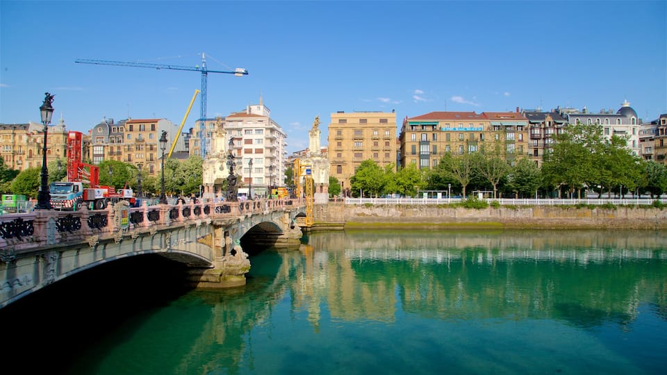 Maria Cristina Bridge featuring a river or creek, a bridge and a city