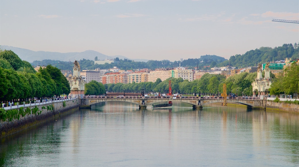 Maria Cristina Bridge featuring a bridge, a city and a river or creek