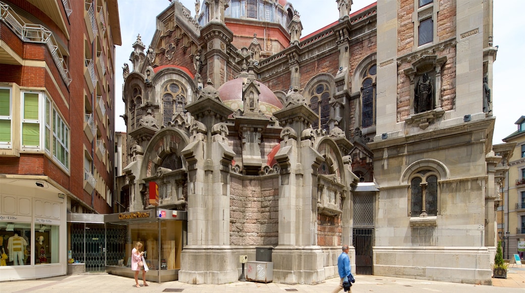 Chiesa di San Giovanni mostrando architettura d\'epoca e strade cosi come ragazzo