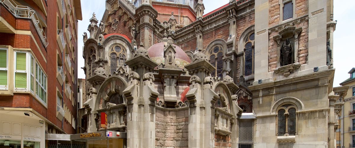 Church of San Juan which includes heritage architecture and street scenes as well as an individual male