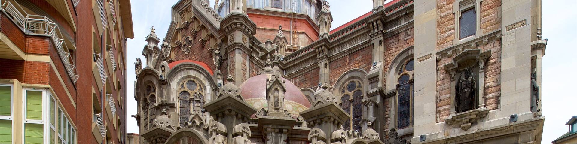 Church of San Juan which includes heritage architecture and street scenes as well as an individual male