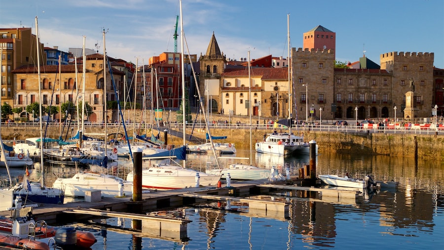 Gijon showing a bay or harbor, a sunset and a city