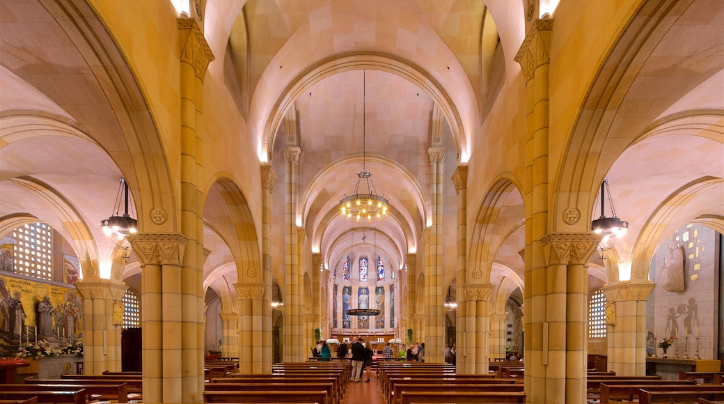 Gijon featuring a church or cathedral, interior views and heritage elements