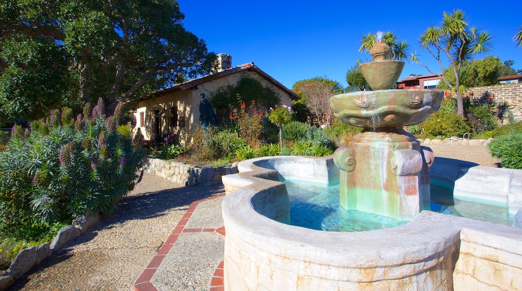 Carmel Mission Basilica featuring a fountain, skyline and heritage architecture