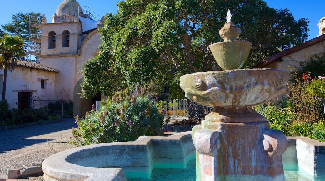 Carmel Mission featuring a fountain, a garden and a bay or harbor