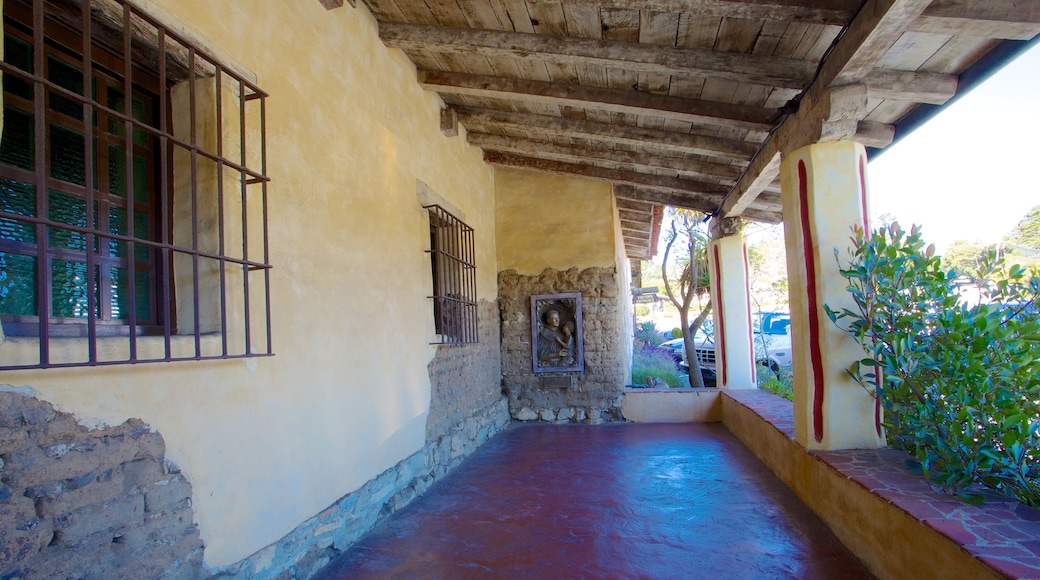 Carmel Mission Basilica showing heritage architecture and a house