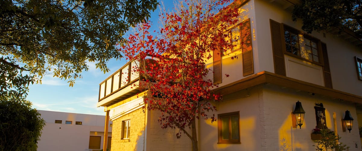 Carmel featuring autumn leaves, a house and a sunset