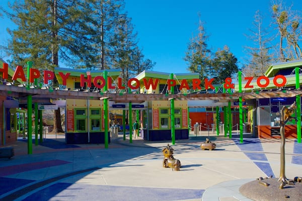 Happy Hollow Park and Zoo showing signage, zoo animals and a park