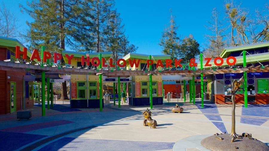 Happy Hollow Park and Zoo som visar en trÀdgÄrd, zoodjur och skyltar