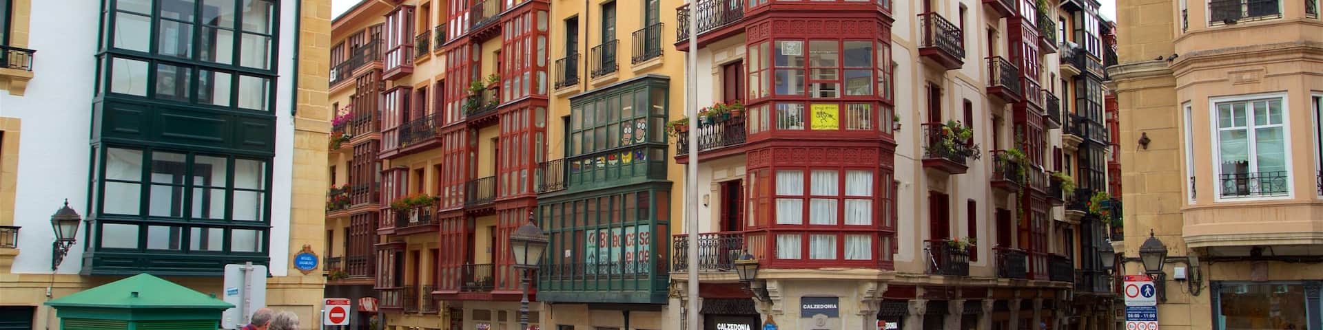Plaza Miguel de Unamuno showing street scenes and a city as well as a small group of people