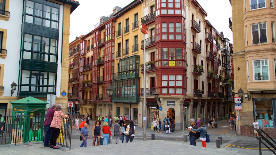 Plaza Miguel de Unamuno showing street scenes and a city as well as a small group of people