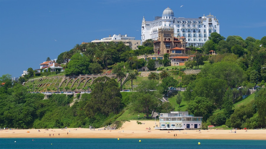 Los Peligros Beach showing a coastal town, a beach and general coastal views