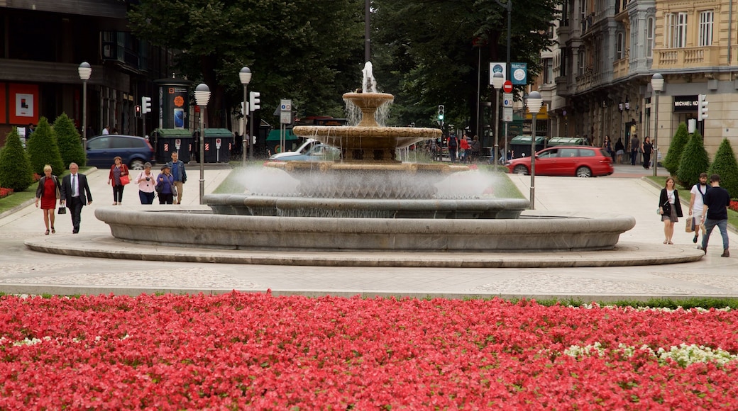 Plaza Moyúa montrant fontaine, jardin et fleurs