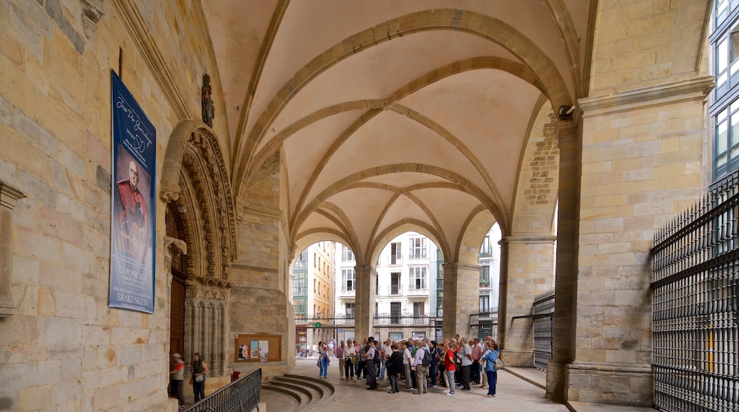 Santiago Cathedral showing heritage elements and interior views as well as a small group of people