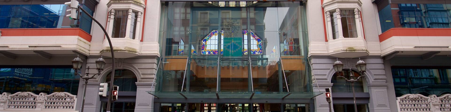 Ribera Market which includes heritage architecture and street scenes as well as a small group of people