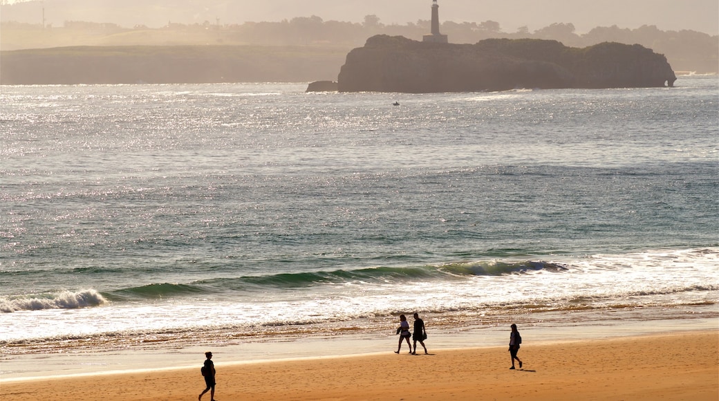 Camello Beach showing a sunset, general coastal views and a lighthouse