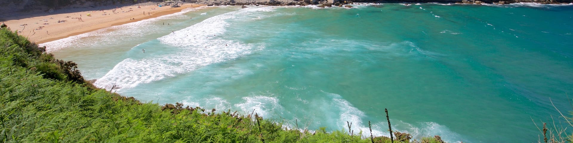 Matalenas Beach featuring general coastal views, rocky coastline and a sandy beach