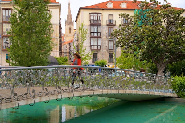 Jardines de Pereda featuring a river or creek, a bridge and hiking or walking