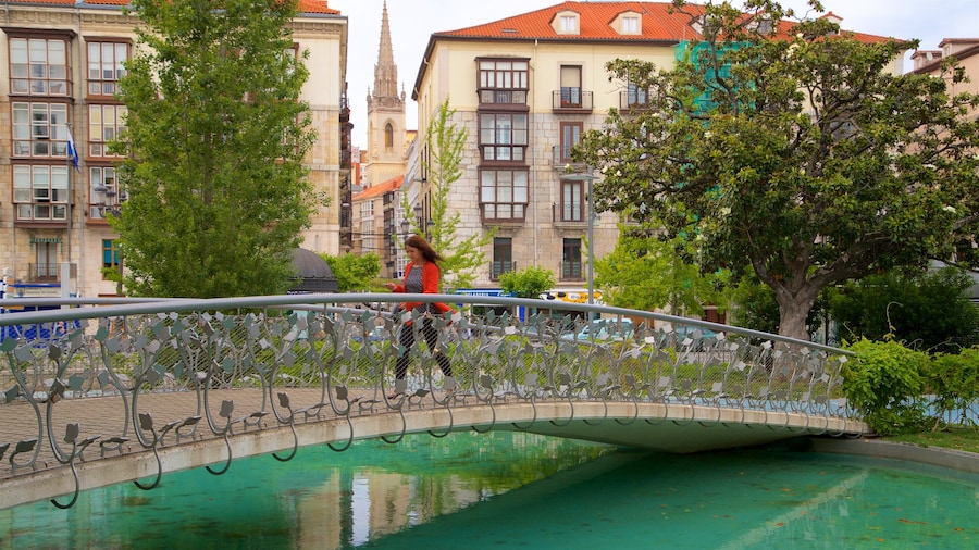 Jardines de Pereda featuring a river or creek, a bridge and hiking or walking