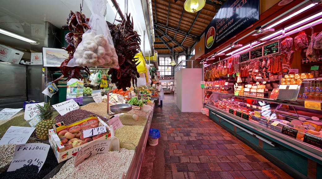 Mercado La Esperanza featuring food, markets and interior views