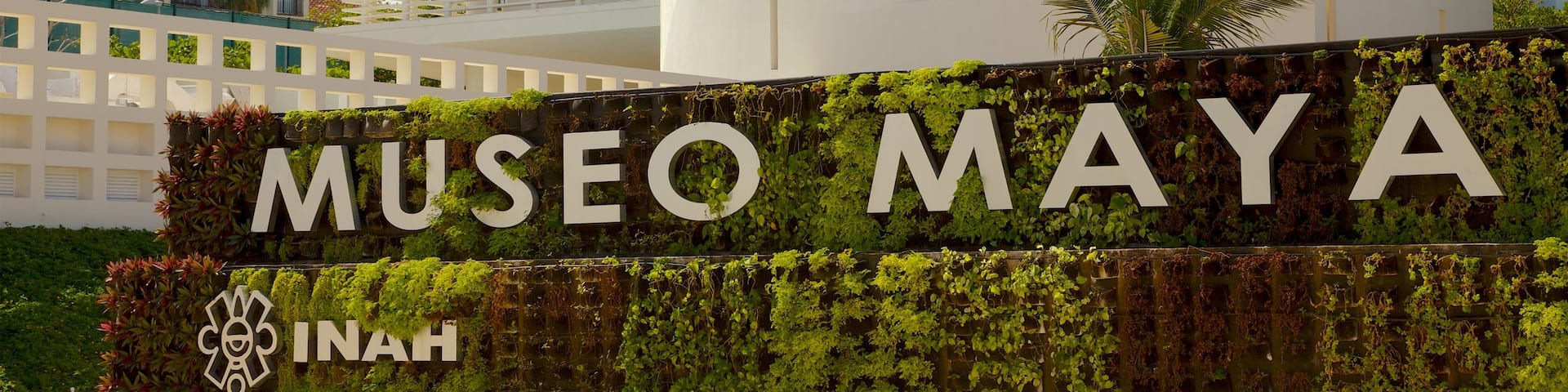 Maya Cancun Museum featuring a park and signage
