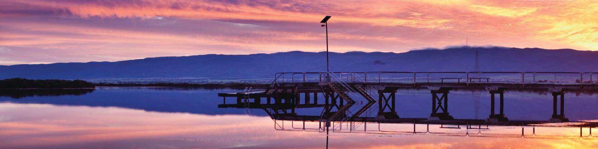 Port Pirie mit einem Bucht oder Hafen, Sonnenuntergang und Landschaften