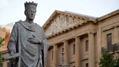 Plaza del Castillo featuring a statue or sculpture and heritage elements