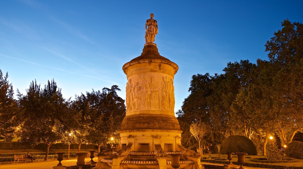 Parque de la Taconera che include paesaggio notturno, giardino e fontana