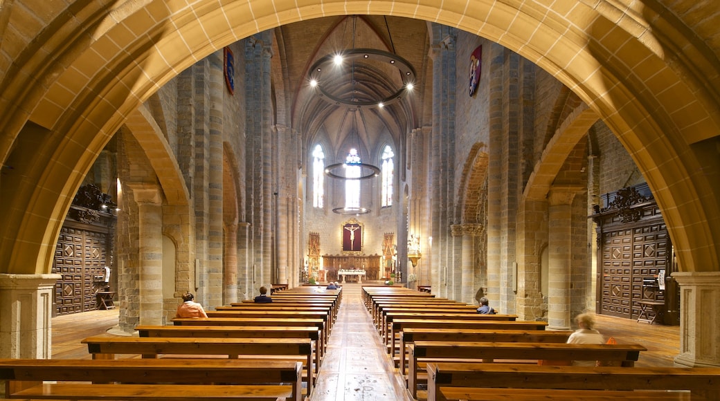 Iglesia de San Nicolas which includes a church or cathedral, interior views and heritage elements